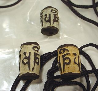 More stone pendants, mani stones, and prayer plaques are listed in our