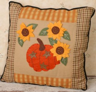 Pictured is a cute primitive stitched pillow. Featured on this pillow