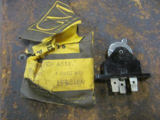 You are bidding on an NOS 1957 Pontiac Heater Blower Switch. Part