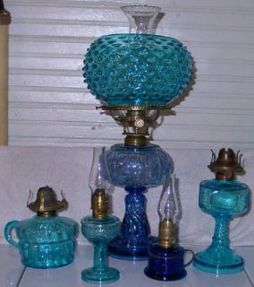 Here is an early oil lamp burner, lip chimney, 5” shade holder, and