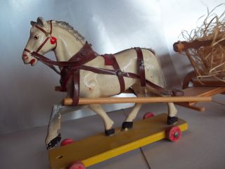 This is a beautiful white wooden horse from the 1930s! Still in good