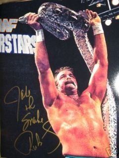 JAKE THE SNAKE ROBERTS AUTOGRAPHED SIGNED 16X20 HOLDS UP